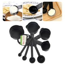 Plastic measuring cups and spoons, black.