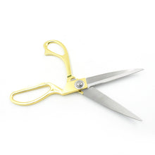 Close-up of the scissors handle and blades showing high-quality stainless steel.