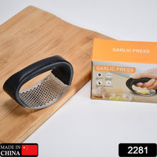 Heavy-duty stainless steel garlic presser for easy crushing.