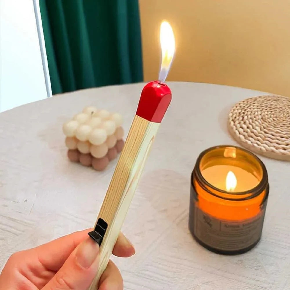 Matchstick lighter product view flat on white background with small flame red cap yellow body black sliding trigger metal hanging loop