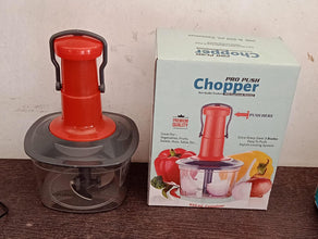 Manual food chopper with locking feature and stainless steel blades