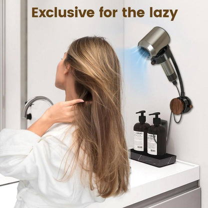 Hands-free hair dryer holder mounted on bathroom wall with woman drying hair