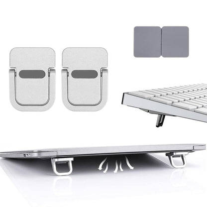 Mini invisible laptop stand silver zinc alloy self-adhesive foldable riser shown on MacBook tablet and phone